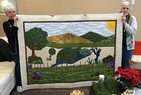 Val Elser and Ann Nolan with quilt