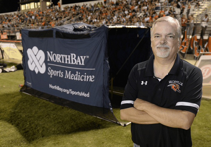 NorthBay Health orthopedic surgeon Robert Peterson, M.D., trades his lab coat for a Vacaville High School Bulldogs football polo shirt for Friday night home games. As team doctor, he’s there on the sidelines to assist if players are hurt.
