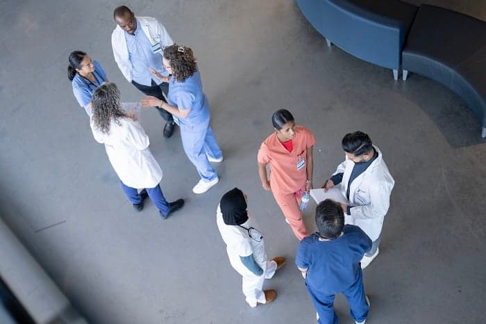 medical students gather and talk to each other